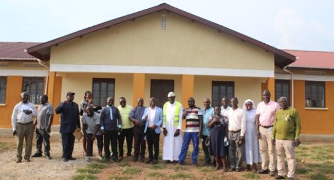 District Leaders Posing for a Group Photo at the ICT Laboratory for St. Andrea Kaahwa Seed Sec. School, after it was handed over for use by The MP for Buruli County Hon. Aled Ronald Akugizibwe